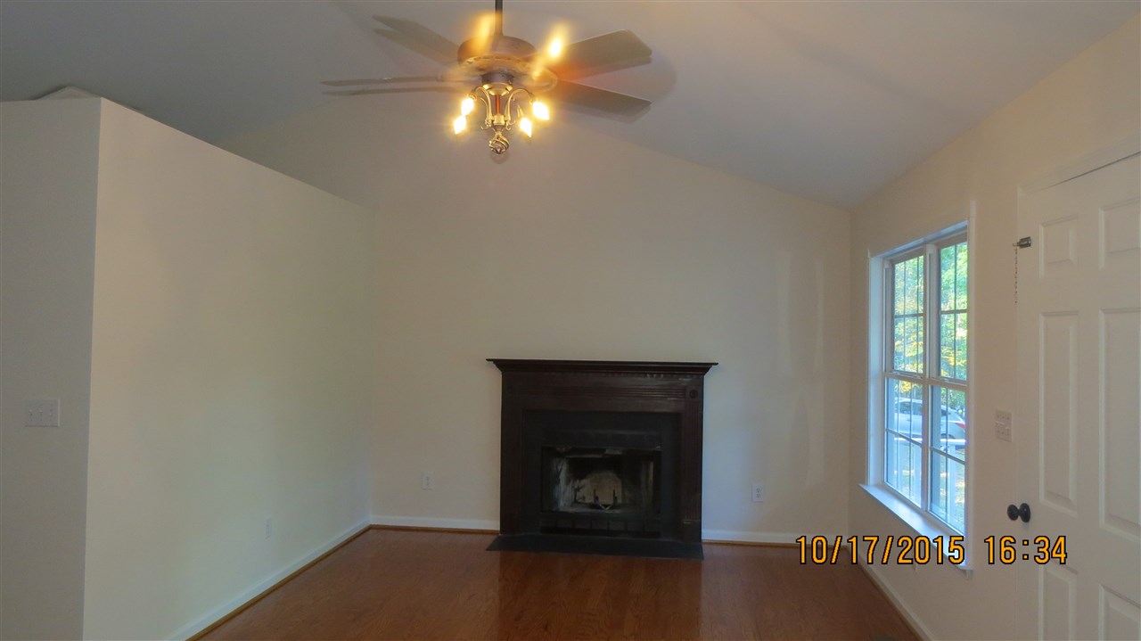 15 Stonefield Road Palmyra, VA 22963 - Photo 2 of 15 wooden floor in an empty room with a window