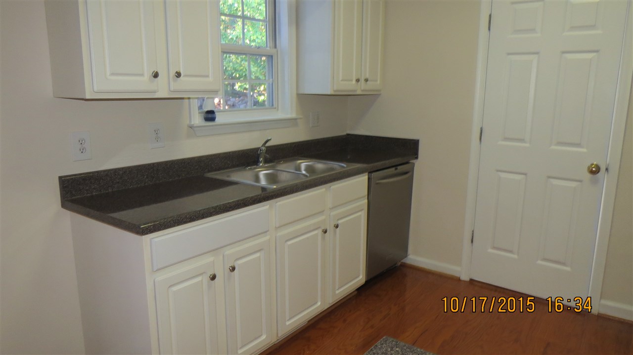 15 Stonefield Road Palmyra, VA 22963 - Photo 5 of 15 a kitchen with granite countertop white cabinets and sink