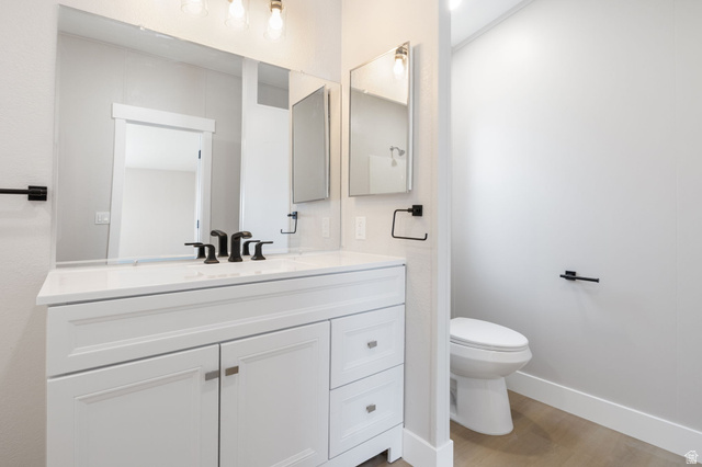 332 Hillgate Way Layton, UT 84041 - Photo 9 of 26 Half bathroom featuring vanity and light wood finished floors