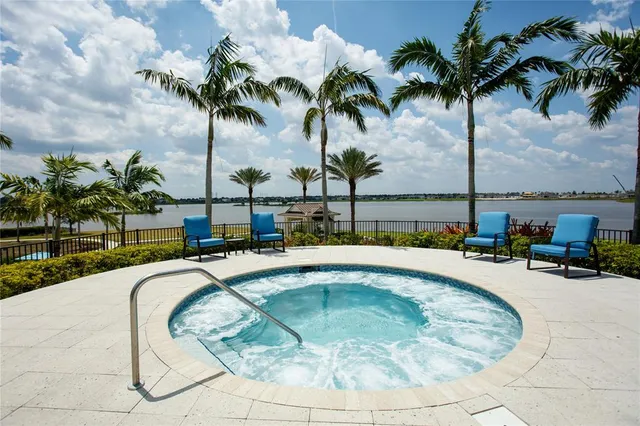 a view of a swimming pool with a table and chairs