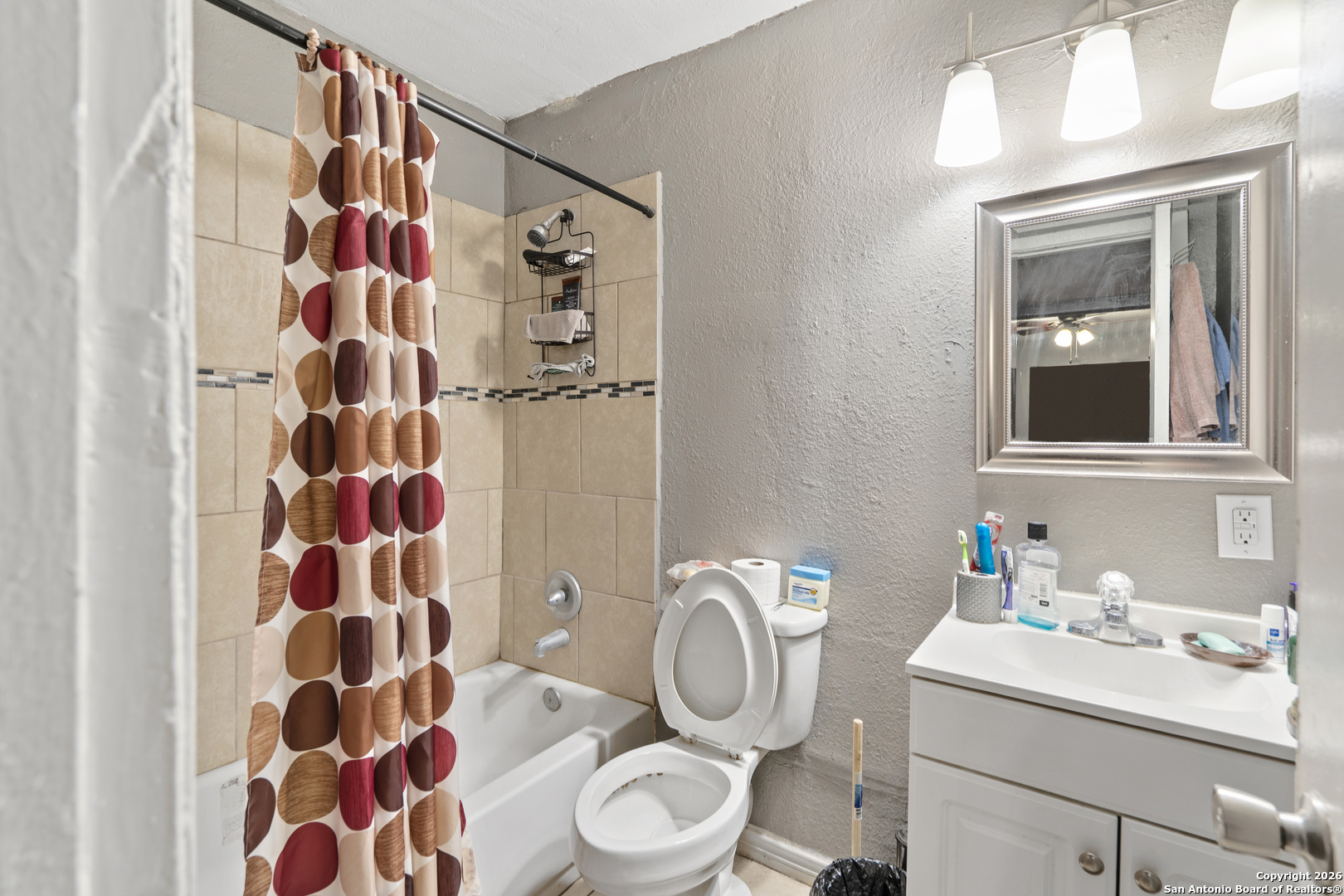 3122 Culebra Road, Unit 104 San Antonio, TX 78228 - Photo 6 of 14 a bathroom with a sink toilet and shower