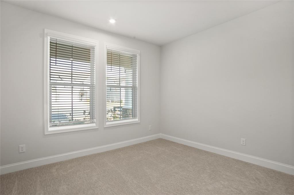 764 Clifftop Crossing Southwest Powder Springs, GA 30127 - Photo 22 of 38 an empty room with a window