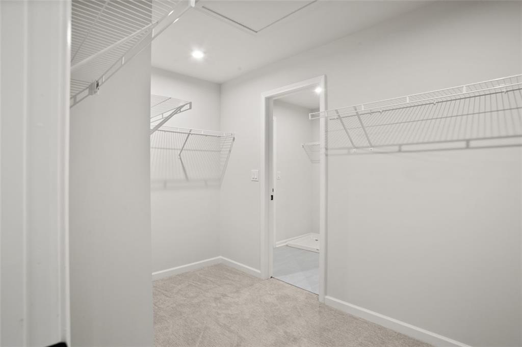 764 Clifftop Crossing Southwest Powder Springs, GA 30127 - Photo 29 of 38 a view of a walk in closet