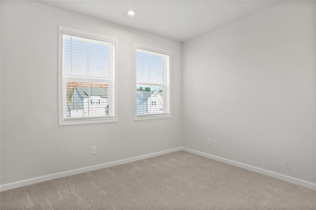 764 Clifftop Crossing Southwest Powder Springs, GA 30127 - Photo 34 of 38 an empty room with windows