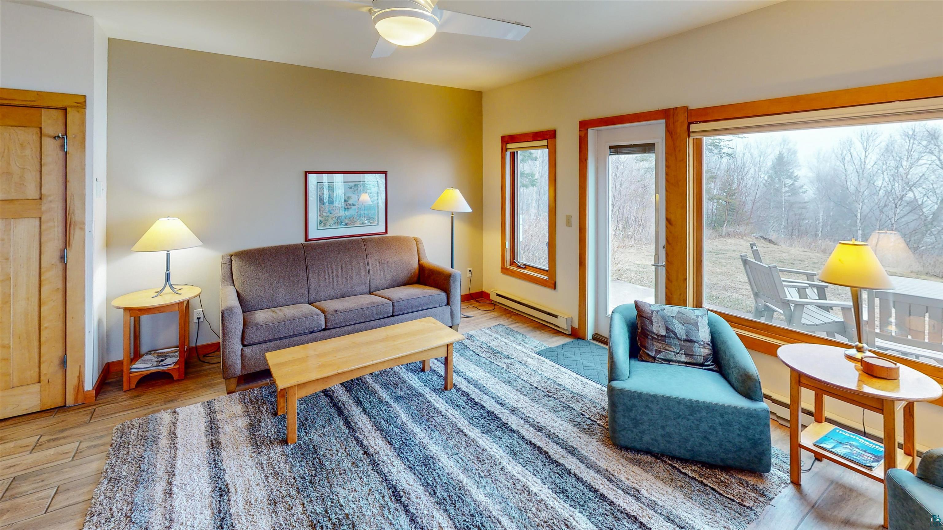 504-506 Poplar River Road, Unit 505 Lutsen, MN 55612 - Photo 30 of 39 Living area featuring wood-finish flooring and a light-toned wall color