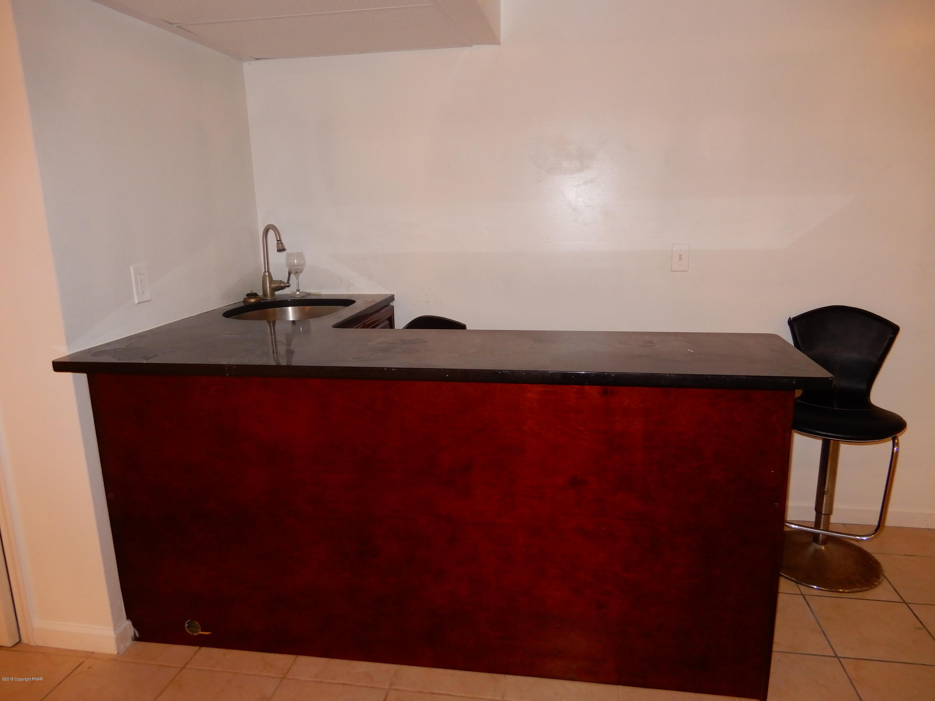 251 Sage Road Long Pond, PA 18334 - Photo 31 of 37 Lower Level Built-In Grantie Bar