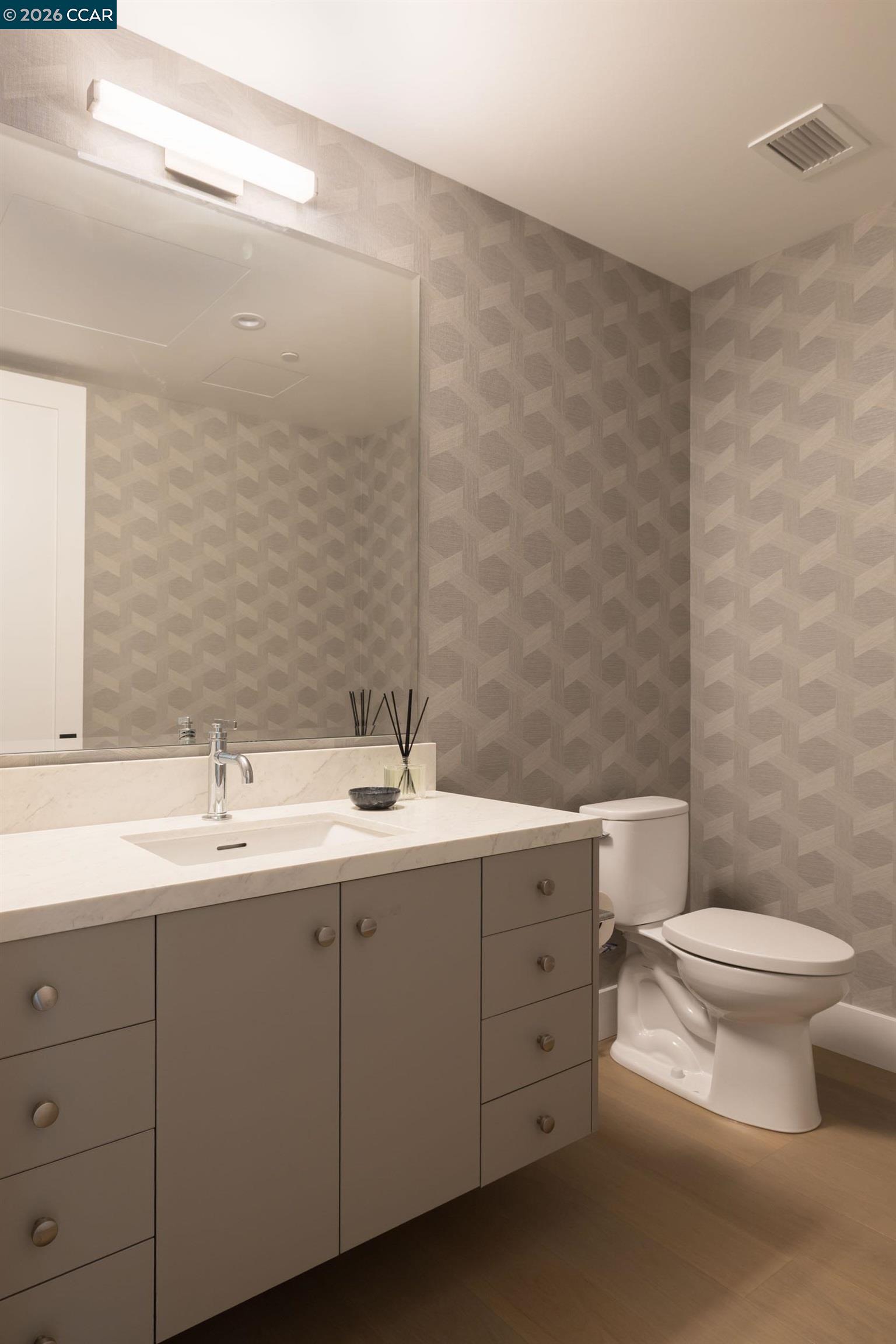 950 Hough Avenue, Unit 202 Lafayette, CA 94549 - Photo 23 of 38 a bathroom with a toilet sink and mirror