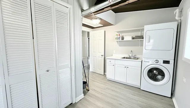 a view of a hallway with washer and dryer