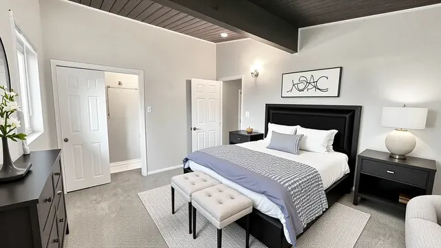 a bedroom with a bed and a lamp