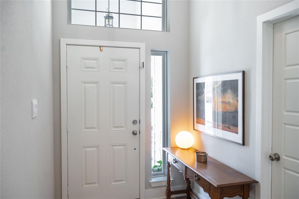 7909 Townsend Drive Waco, TX 76708 - Photo 4 of 22 Entryway featuring a paneled door, transom window with grid detailing, and a side light