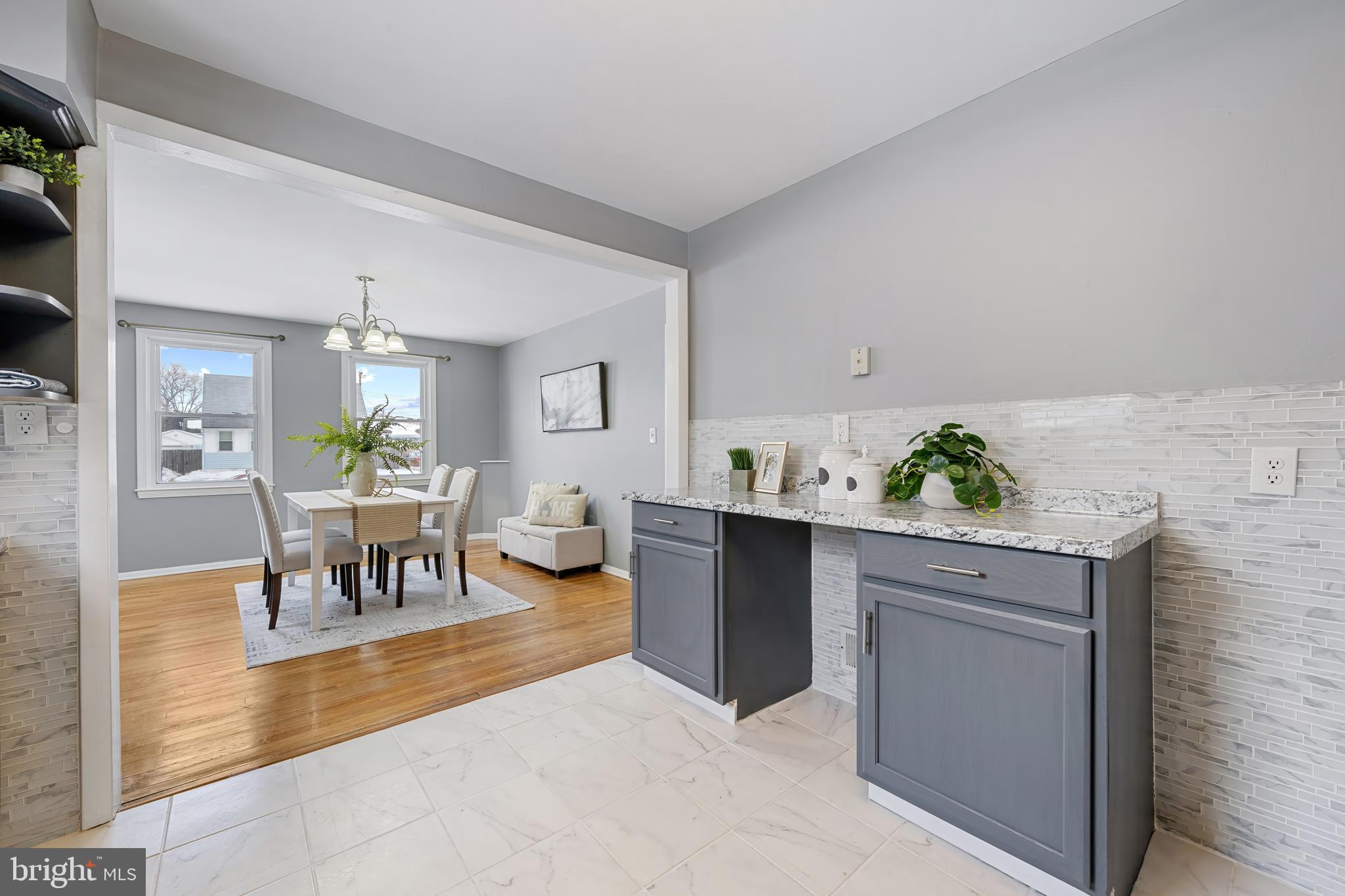 911 Homberg Avenue Baltimore, MD 21221 - Photo 11 of 28 a living room with stainless steel appliances kitchen island granite countertop furniture and a potted plant