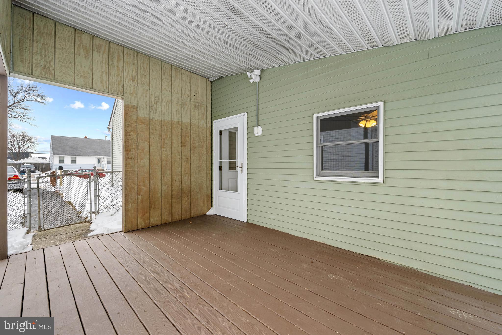 911 Homberg Avenue Baltimore, MD 21221 - Photo 17 of 28 a view of a hallway with wooden floor