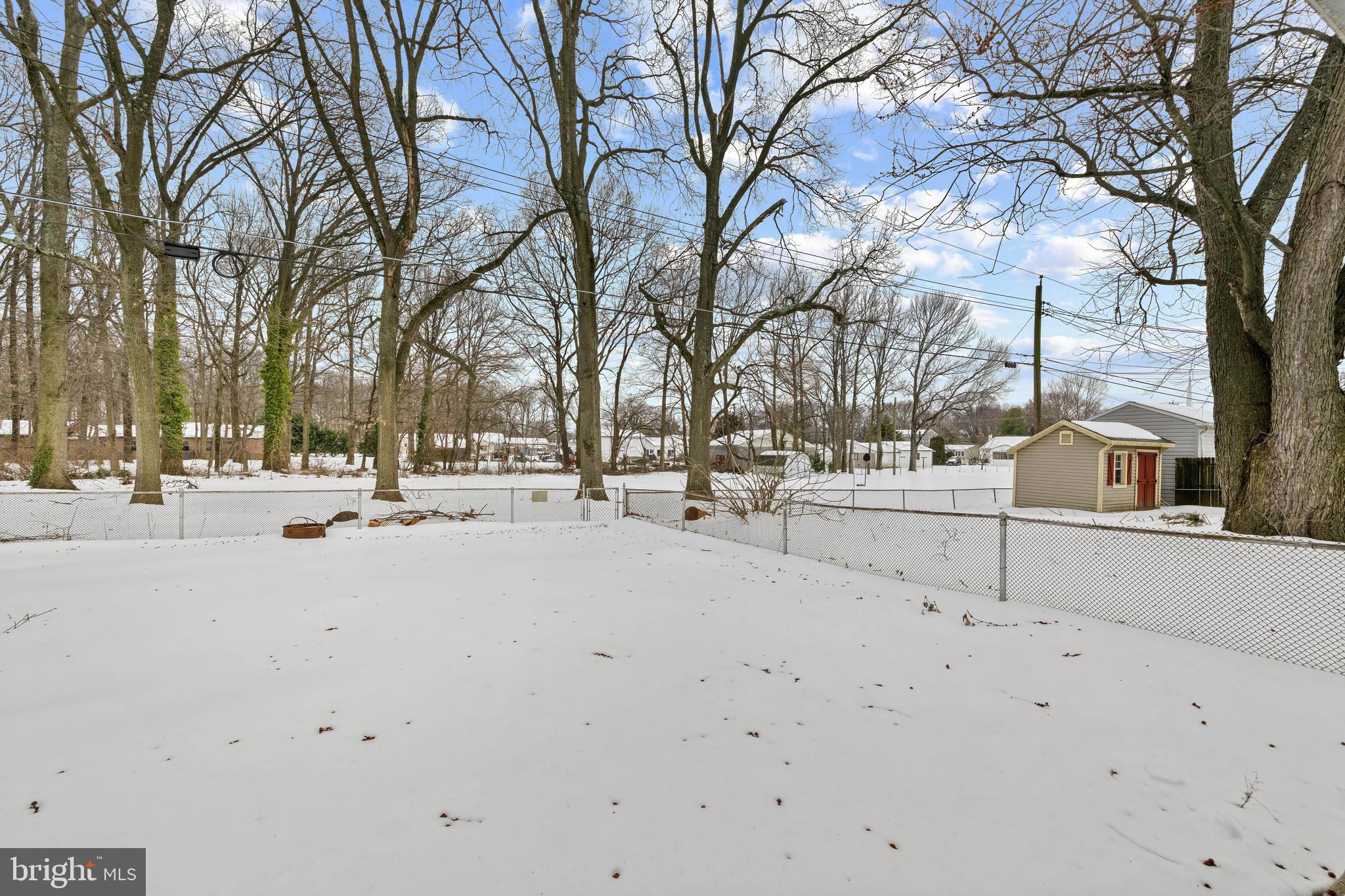 911 Homberg Avenue Baltimore, MD 21221 - Photo 8 of 28 a view of road with trees