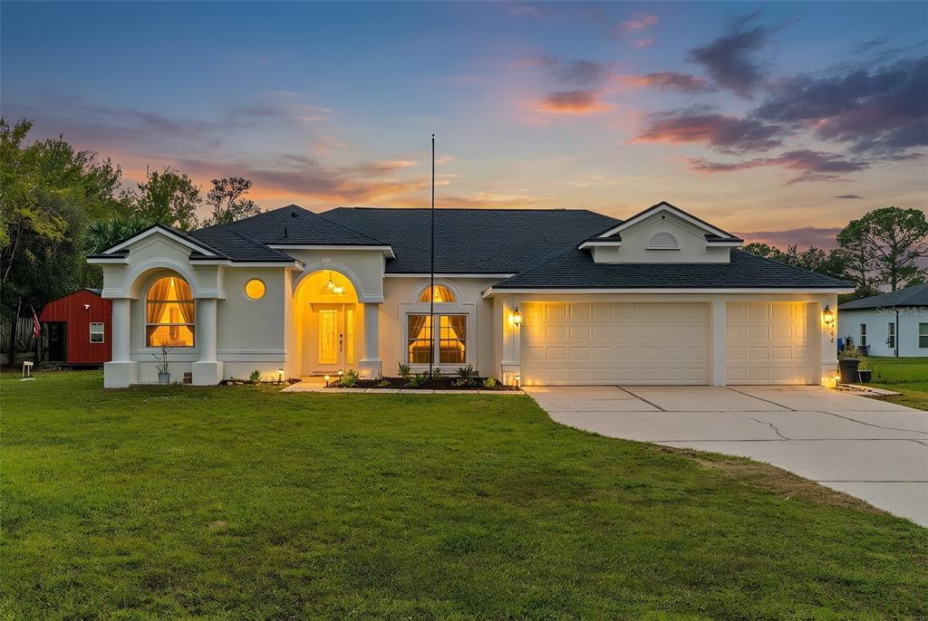 20744 Sheldon Street Orlando, FL 32833 - Photo 1 of 50 a view of a house with a big yard and a large tree
