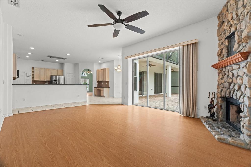 20744 Sheldon Street Orlando, FL 32833 - Photo 18 of 50 a view of an empty room with a fireplace and a window