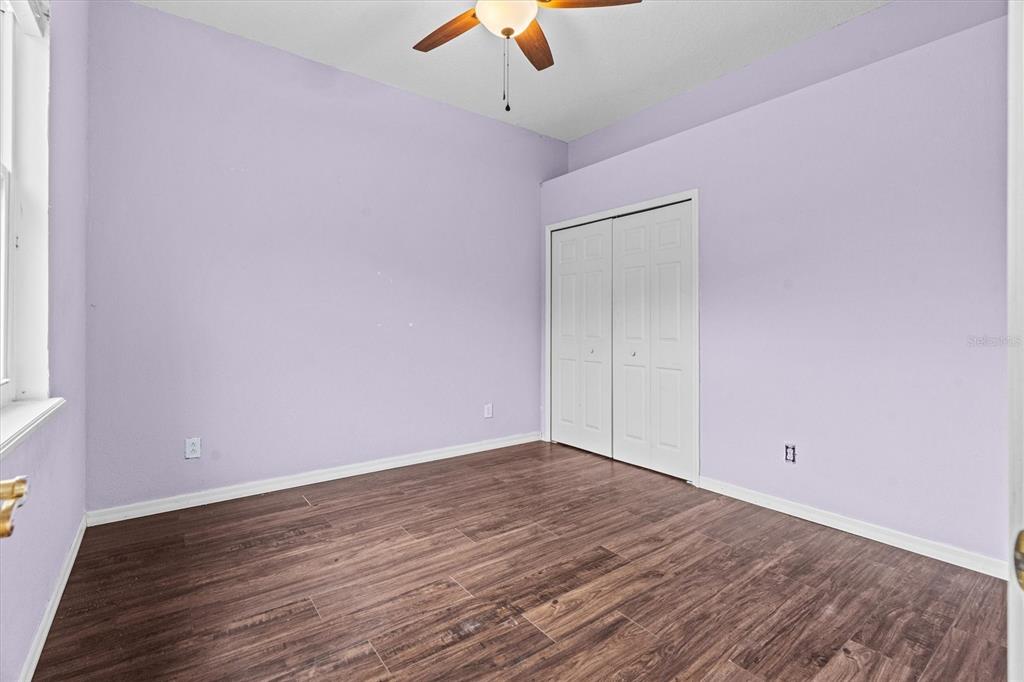 20744 Sheldon Street Orlando, FL 32833 - Photo 26 of 50 a view of an empty room with wooden floor