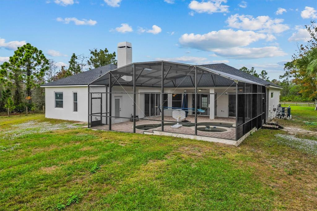 20744 Sheldon Street Orlando, FL 32833 - Photo 33 of 50 a view of a house with a yard porch and sitting area