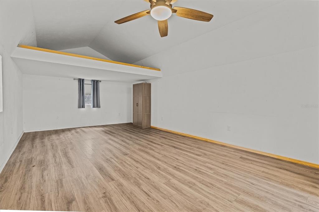 20744 Sheldon Street Orlando, FL 32833 - Photo 36 of 50 a view of empty room with wooden floor