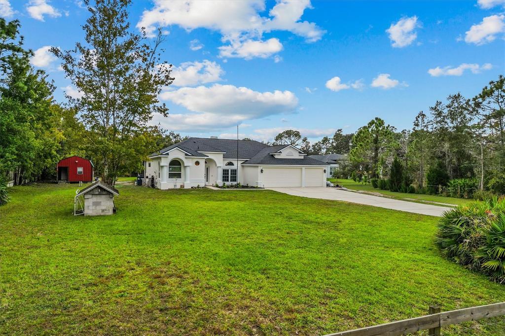 20744 Sheldon Street Orlando, FL 32833 - Photo 49 of 50 a house view with swimming pool and garden