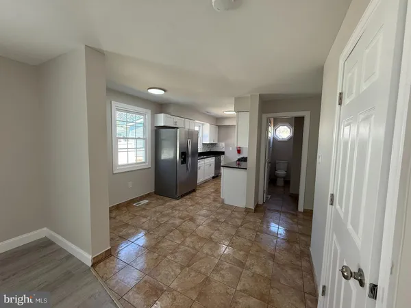 a view of a kitchen cabinets and windows