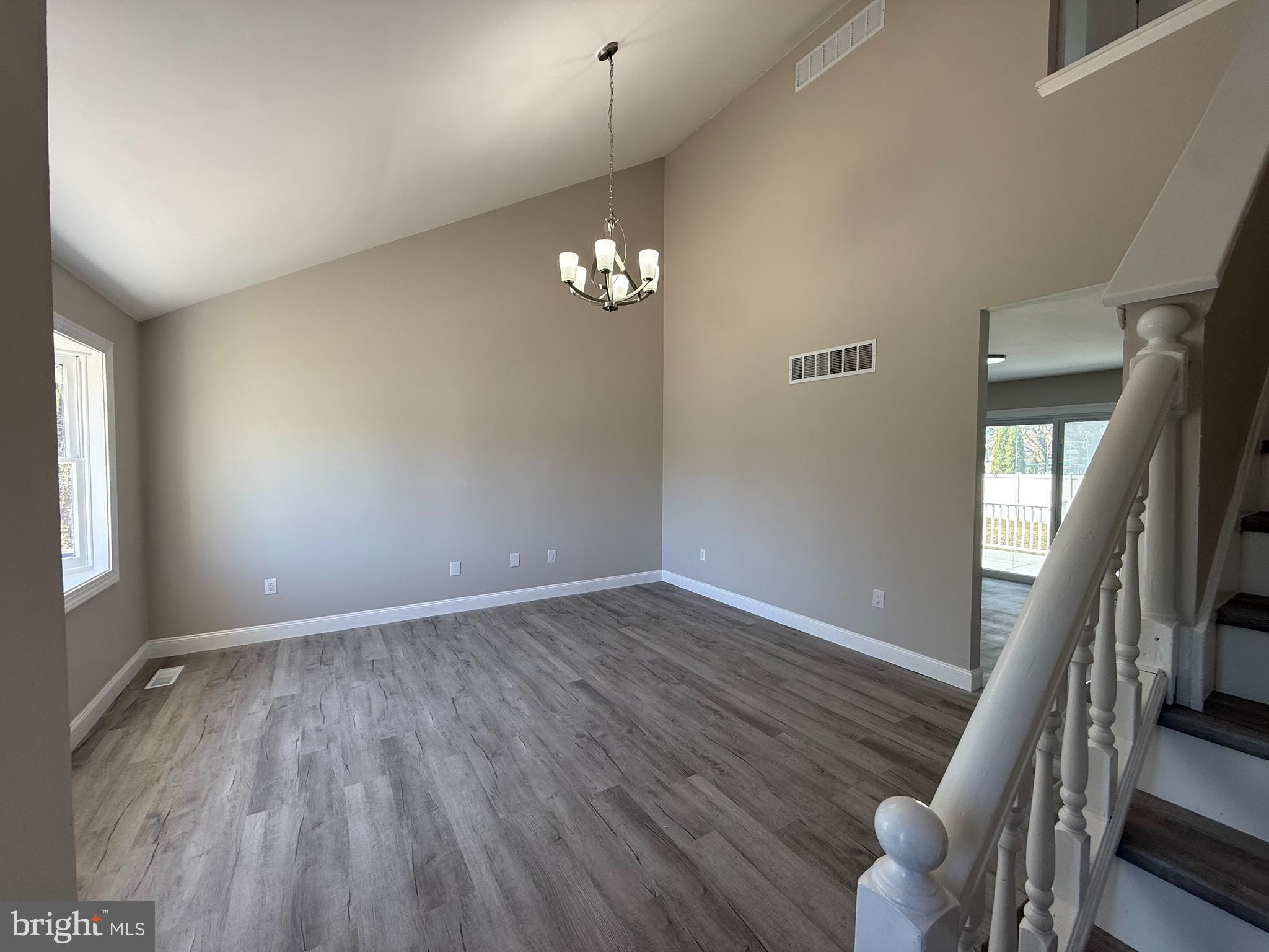 82 Dare Avenue Bridgeton, NJ 08302 - Photo 19 of 39 wooden floor in an empty room with a window