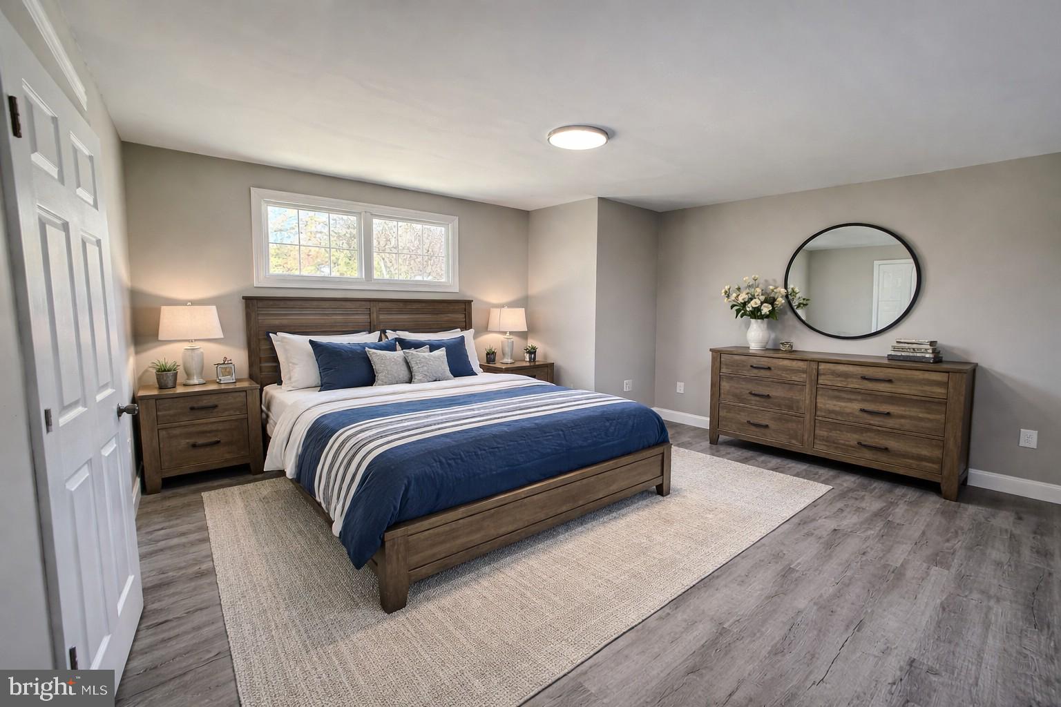 82 Dare Avenue Bridgeton, NJ 08302 - Photo 27 of 39 a bedroom with a bed a closet and windows