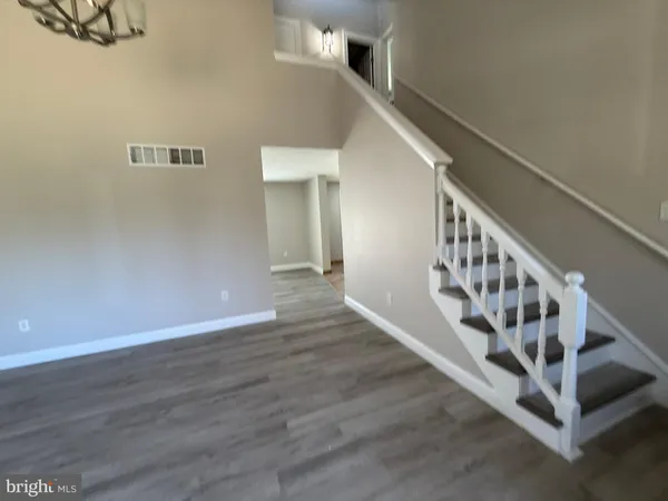 a view of entryway with wooden floor