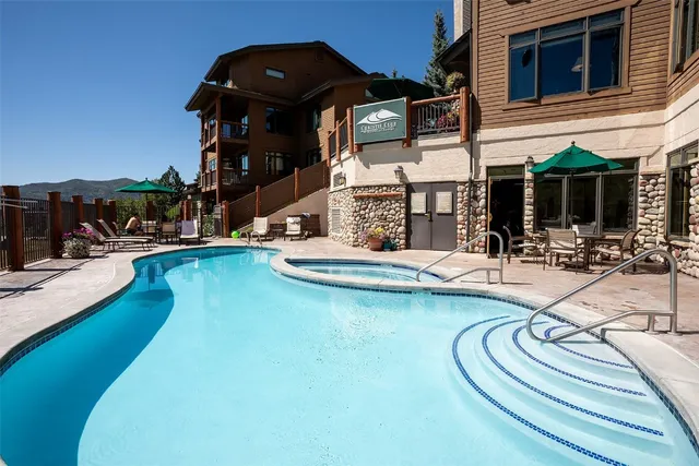 a view of a swimming pool with chairs