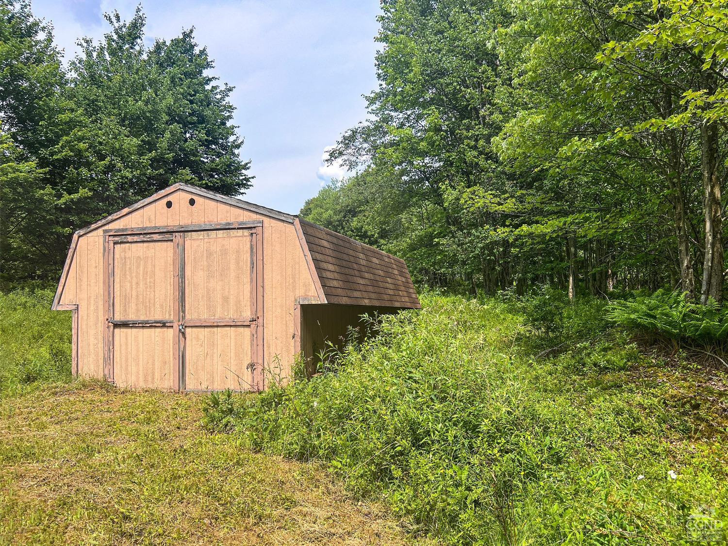 0 Scotch Hill Road Bloomville, NY 13739 - Photo 15 of 40 a front view of a house with a yard