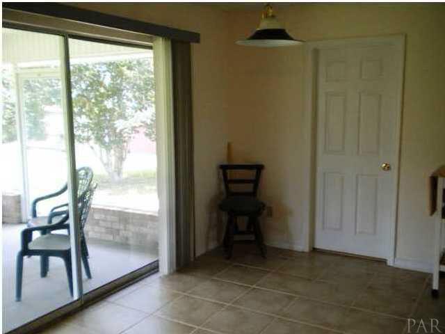 2247 Cricket Ridge Drive Cantonment, FL 32533 - Photo 10 of 25 Dining Area with view of screened porch