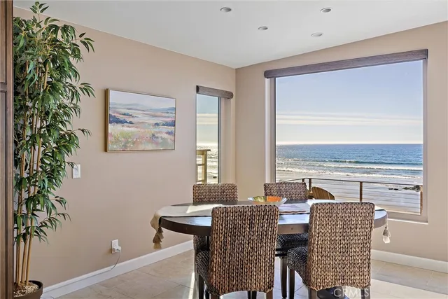 a view of a dining room with furniture window and outside view