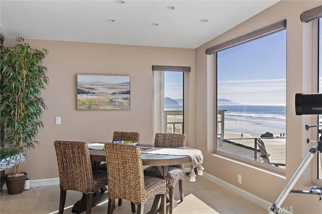 a view of a dining room with furniture window and outside view