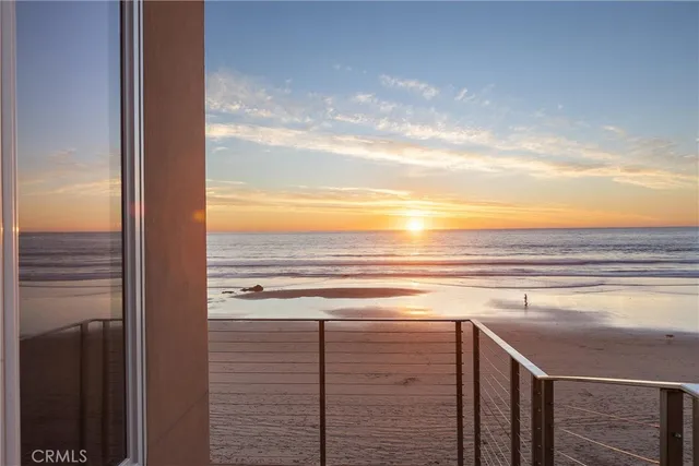 a spacious bedroom with a bed and a flat screen tv