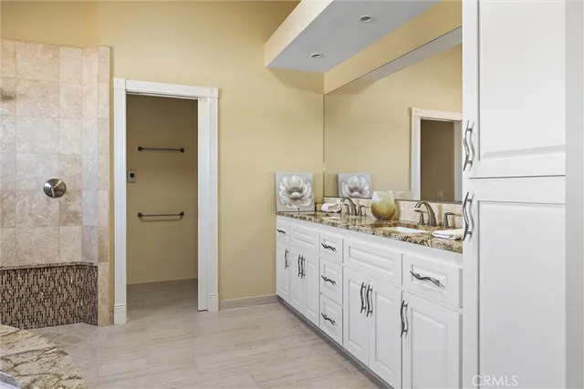 a bathroom with a tub and shower