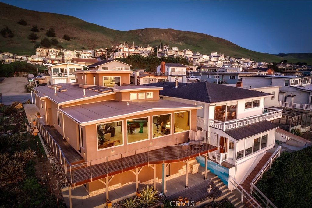 3352 Studio Drive Cayucos, CA 93430 - Photo 3 of 55 a view of a large building with a mountain