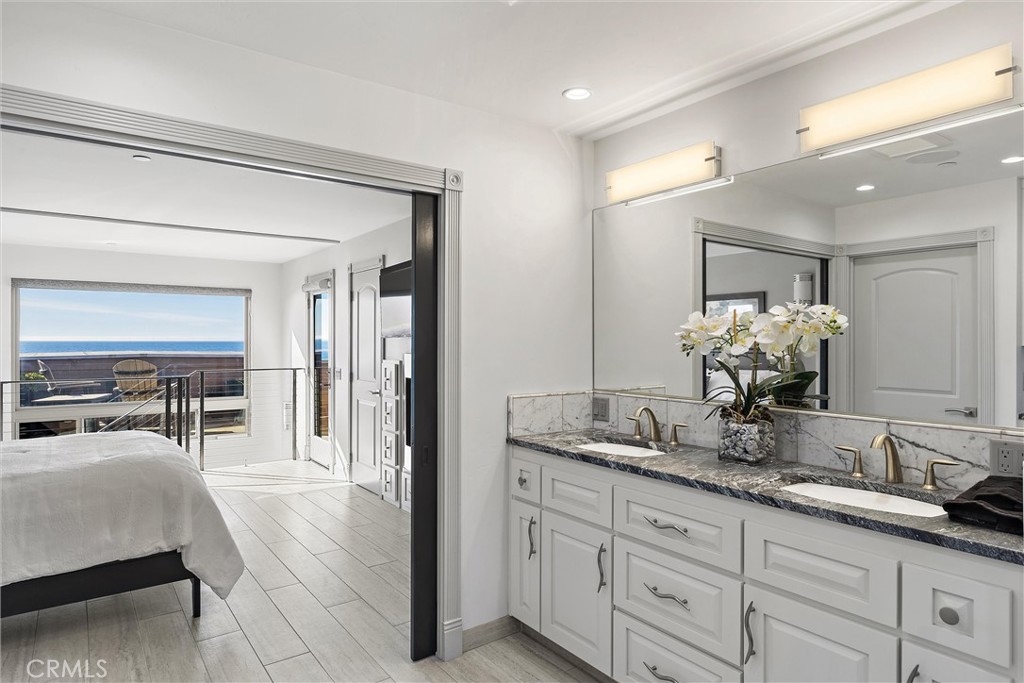 3352 Studio Drive Cayucos, CA 93430 - Photo 33 of 55 a en suite bathroom with double sink and a mirror