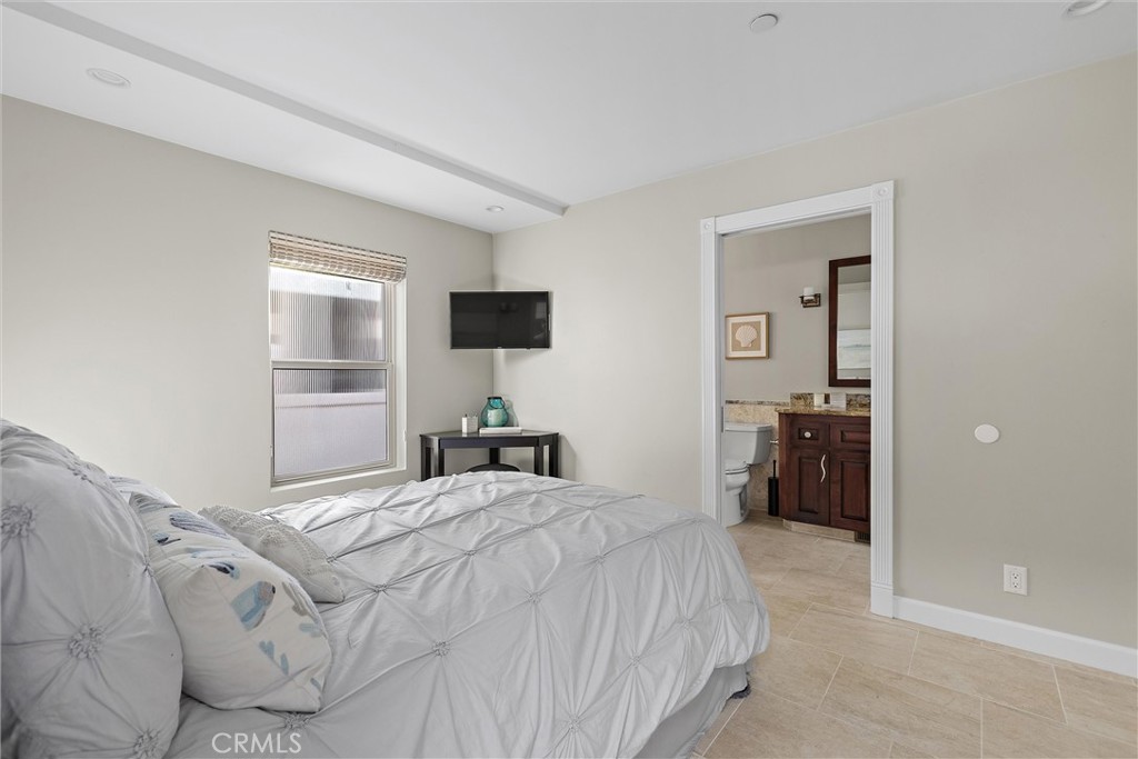 3352 Studio Drive Cayucos, CA 93430 - Photo 35 of 55 a bedroom with a bed and a flat screen tv