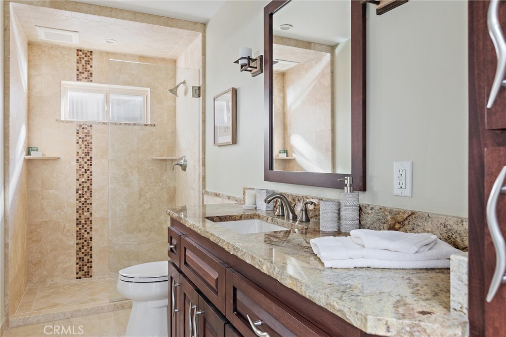 3352 Studio Drive Cayucos, CA 93430 - Photo 37 of 55 a bathroom with a granite countertop sink toilet and shower