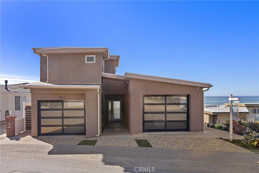 3352 Studio Drive Cayucos, CA 93430 - Photo 46 of 55 a front view of a house with garage