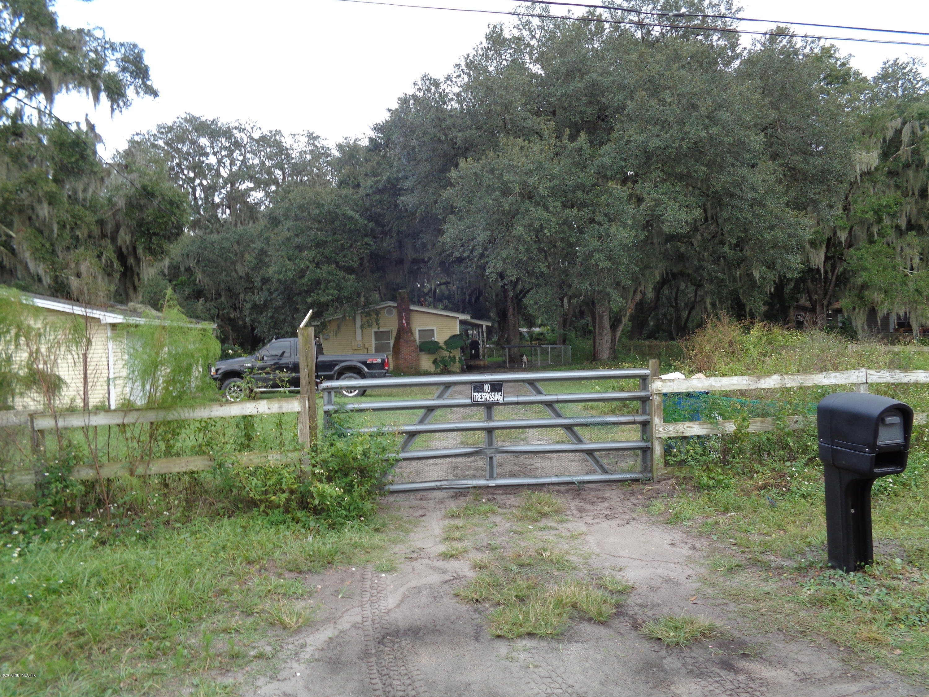 a view of backyard with green space