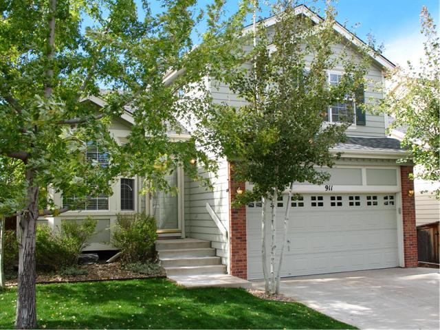 911 Riddlewood Road Highlands Ranch, CO 80129 - Photo 1 of 1 a view of a house with a yard and garage