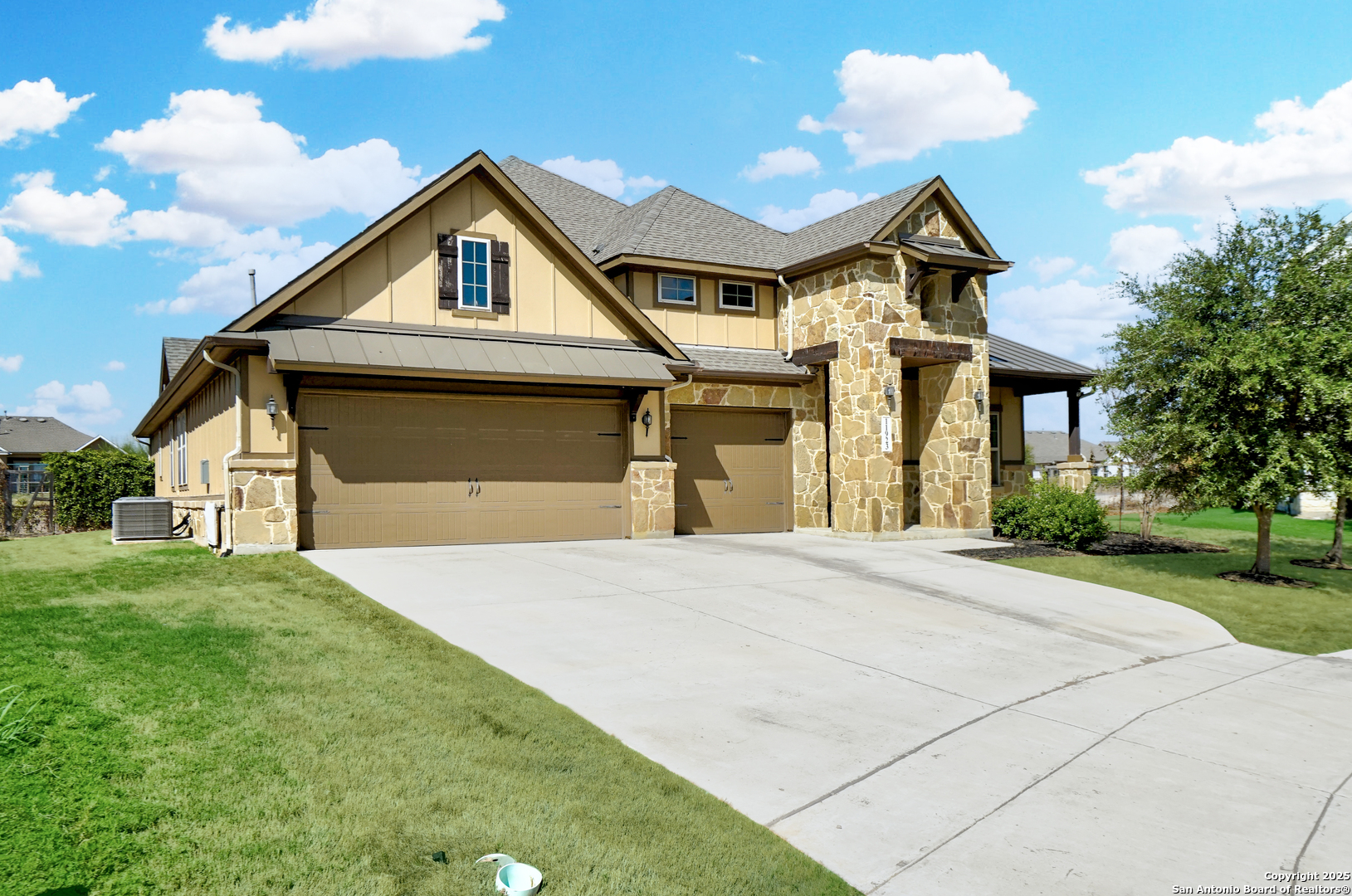 11923 Hollering Pass Schertz, TX 78154 - Photo 2 of 43 a front view of a house with a yard and garage