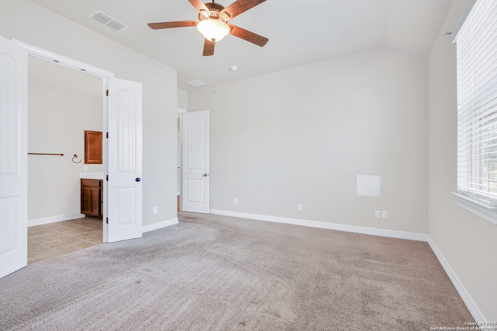 11923 Hollering Pass Schertz, TX 78154 - Photo 23 of 43 wooden floor in an empty room with a window