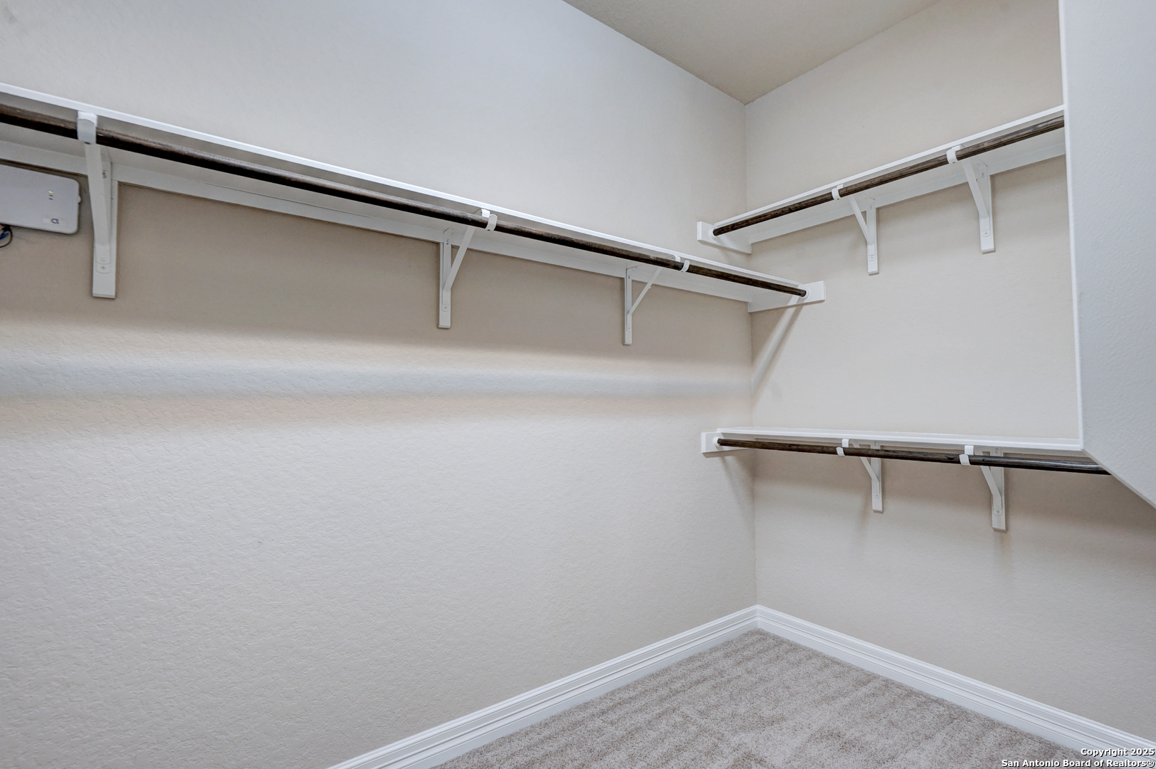 11923 Hollering Pass Schertz, TX 78154 - Photo 27 of 43 a view of an empty walk in closet