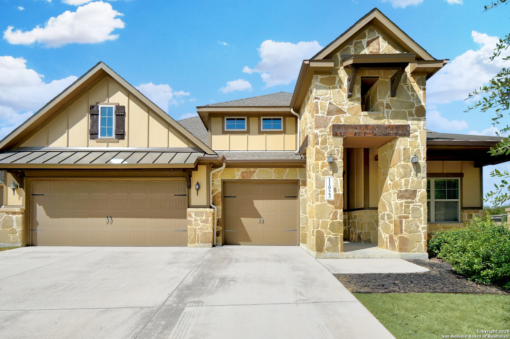 11923 Hollering Pass Schertz, TX 78154 - Photo 3 of 43 a front view of a house with a yard and garage