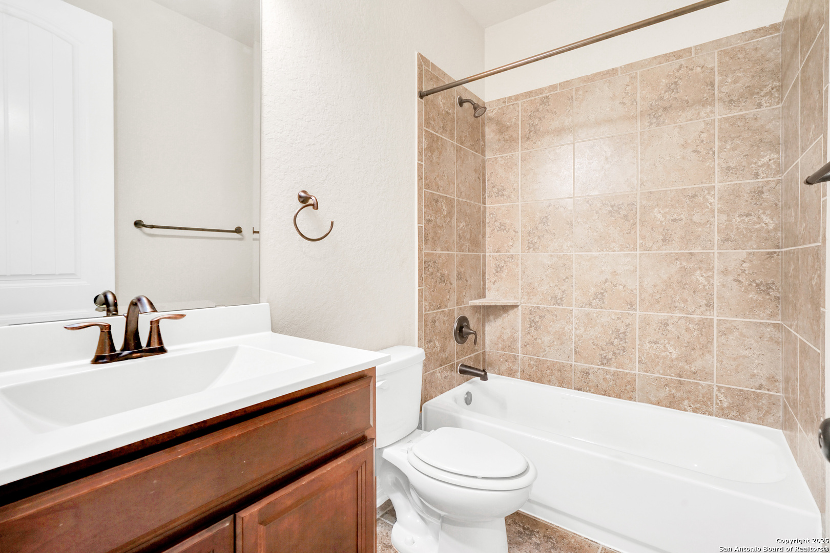 11923 Hollering Pass Schertz, TX 78154 - Photo 31 of 43 a bathroom with a sink a toilet and shower