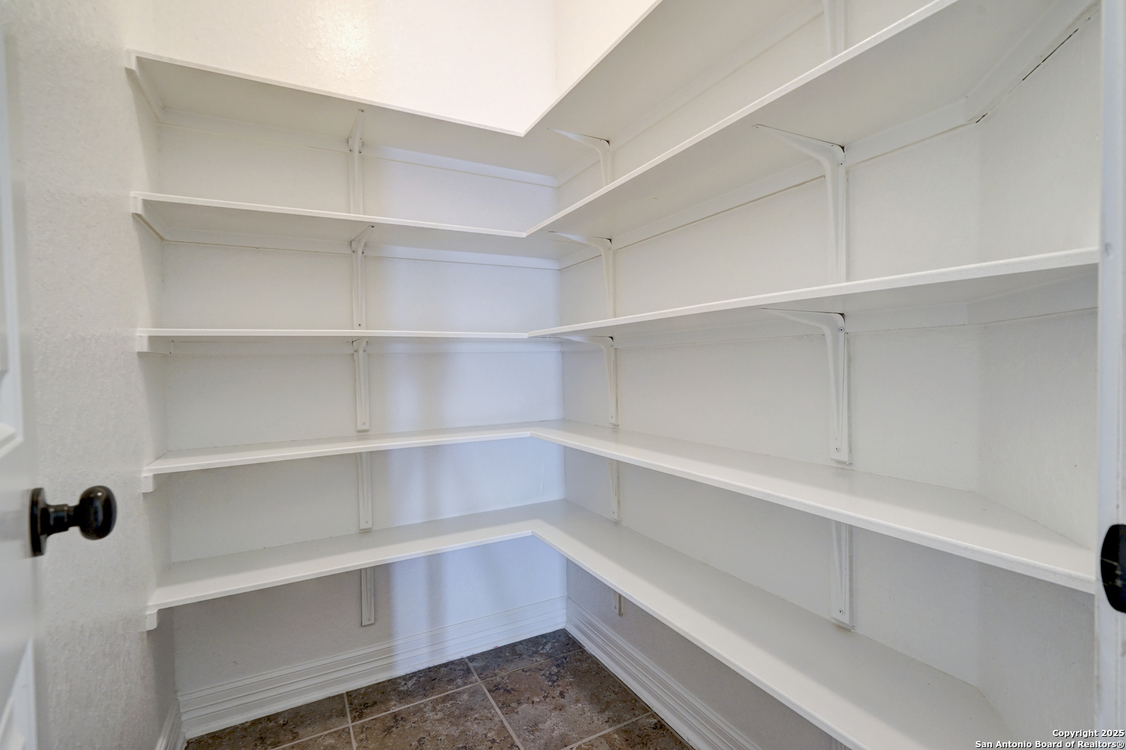 11923 Hollering Pass Schertz, TX 78154 - Photo 38 of 43 a view of walk in closet with empty racks