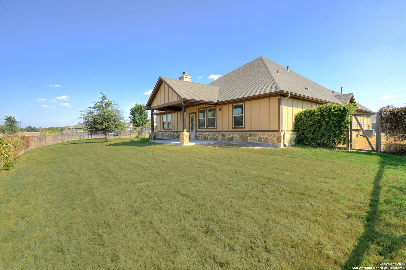 11923 Hollering Pass Schertz, TX 78154 - Photo 41 of 43 a front view of a house with a yard