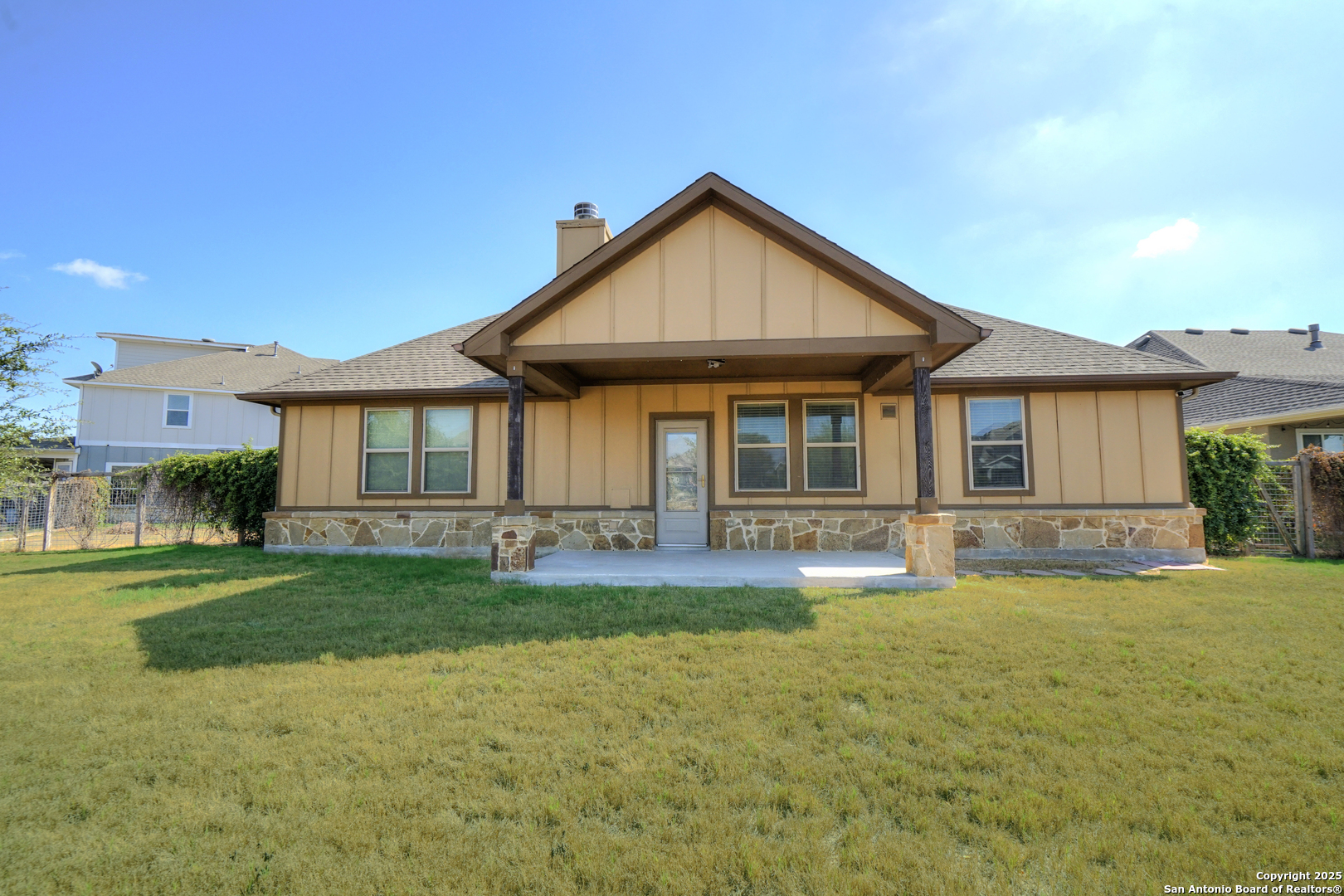 11923 Hollering Pass Schertz, TX 78154 - Photo 42 of 43 a front view of a house with a garden and yard