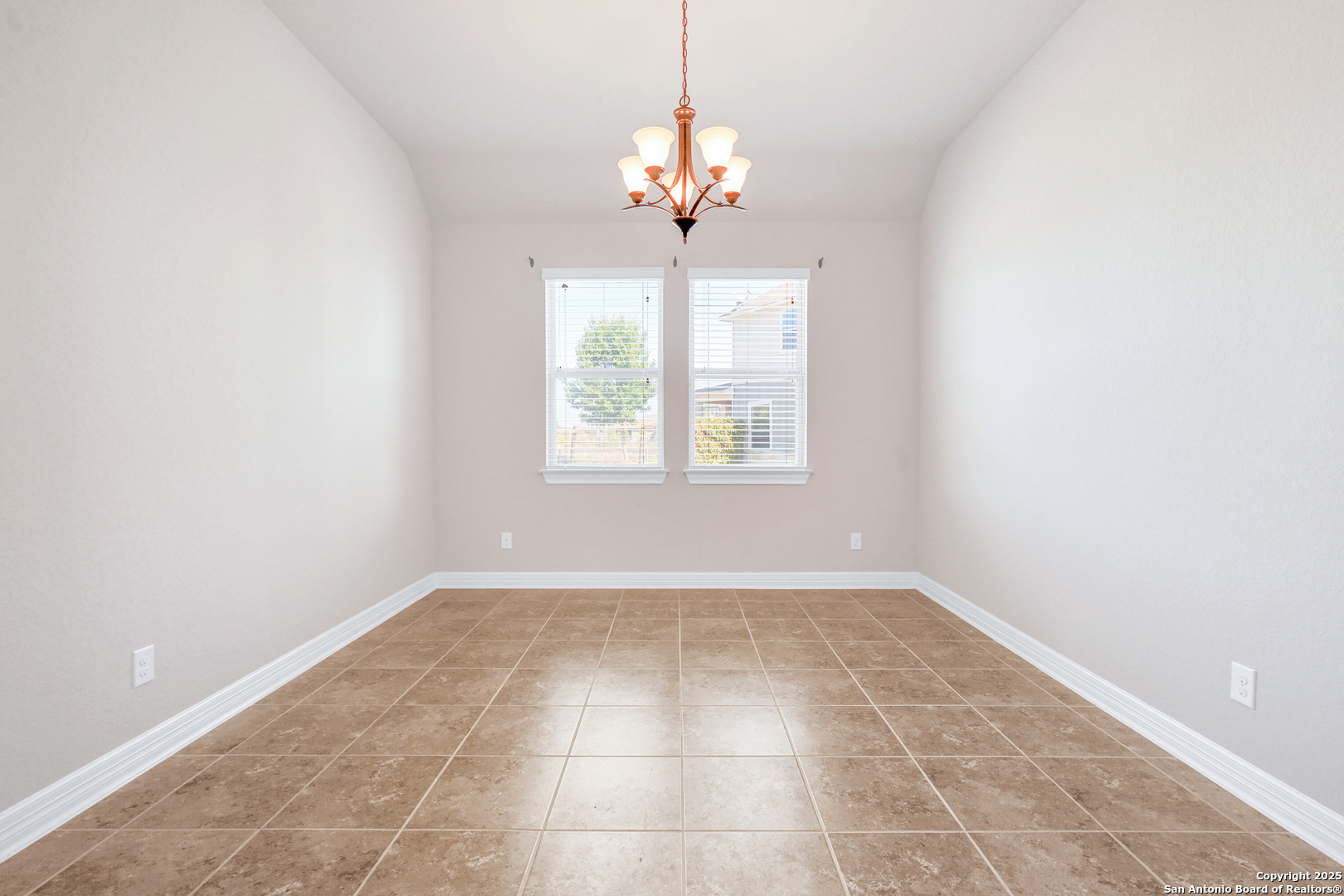 11923 Hollering Pass Schertz, TX 78154 - Photo 5 of 43 a view of an empty room with a window